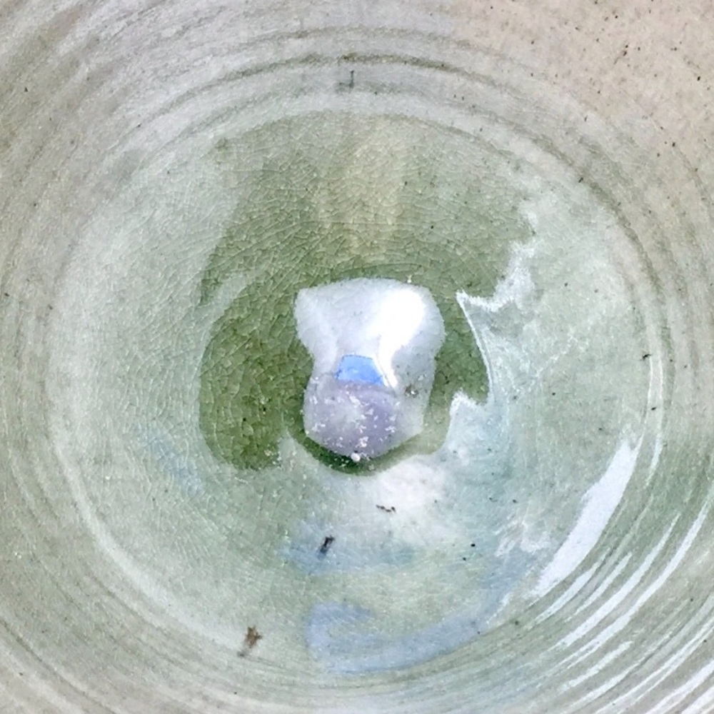 Handcrafted very large pale green glazed asymmetrical ceramic bowl